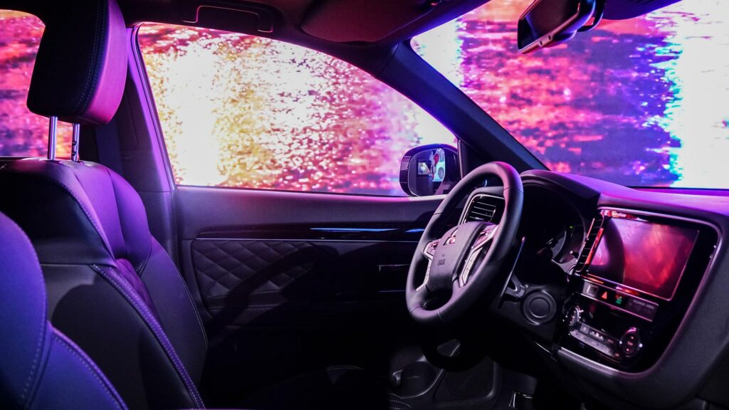 LED screen in car showroom in a Mitsubishi shows seasons