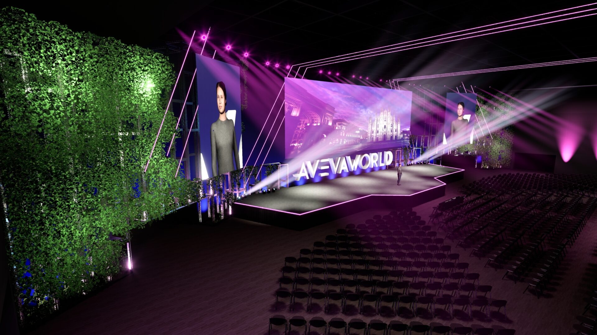 A futuristic, purple-lit stage setup for an event, with large screens displaying a woman speaking, “AVEVA WORLD” text on the stage, rows of empty chairs, and green vertical gardens on the sides.