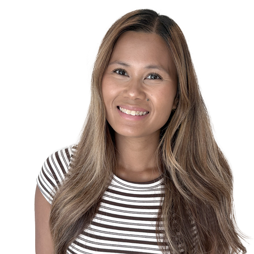 Smiling woman with long, straight brown hair wearing a white and brown striped shirt, posing against a plain white background.